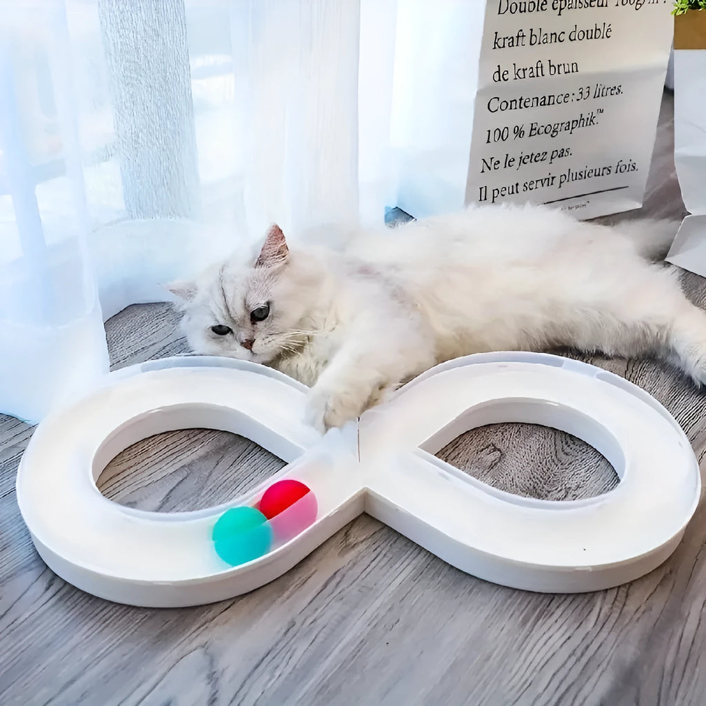 Blue and white interactive cat toy set with turntable track, ball, and teasing stick on floor