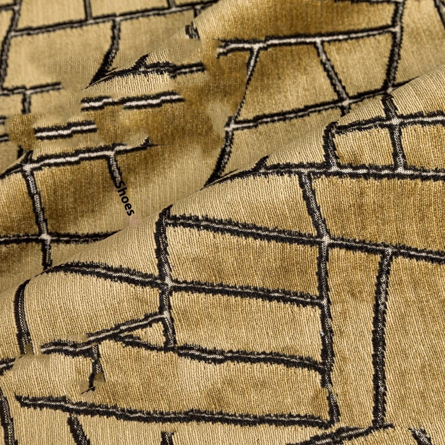 Geometric abstract patterned cushion in local tyrant gold colour, shown in square and lumbar pillow sizes.