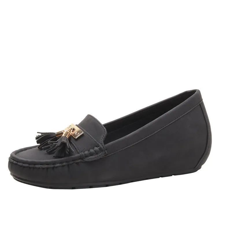 Women's beige height increasing insole casual work shoes with round toe and mid heel.