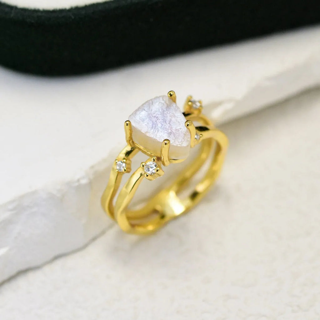 S925 silver irregular triangle moonstone ring in rose gold, white gold, or yellow gold colour on a hand.