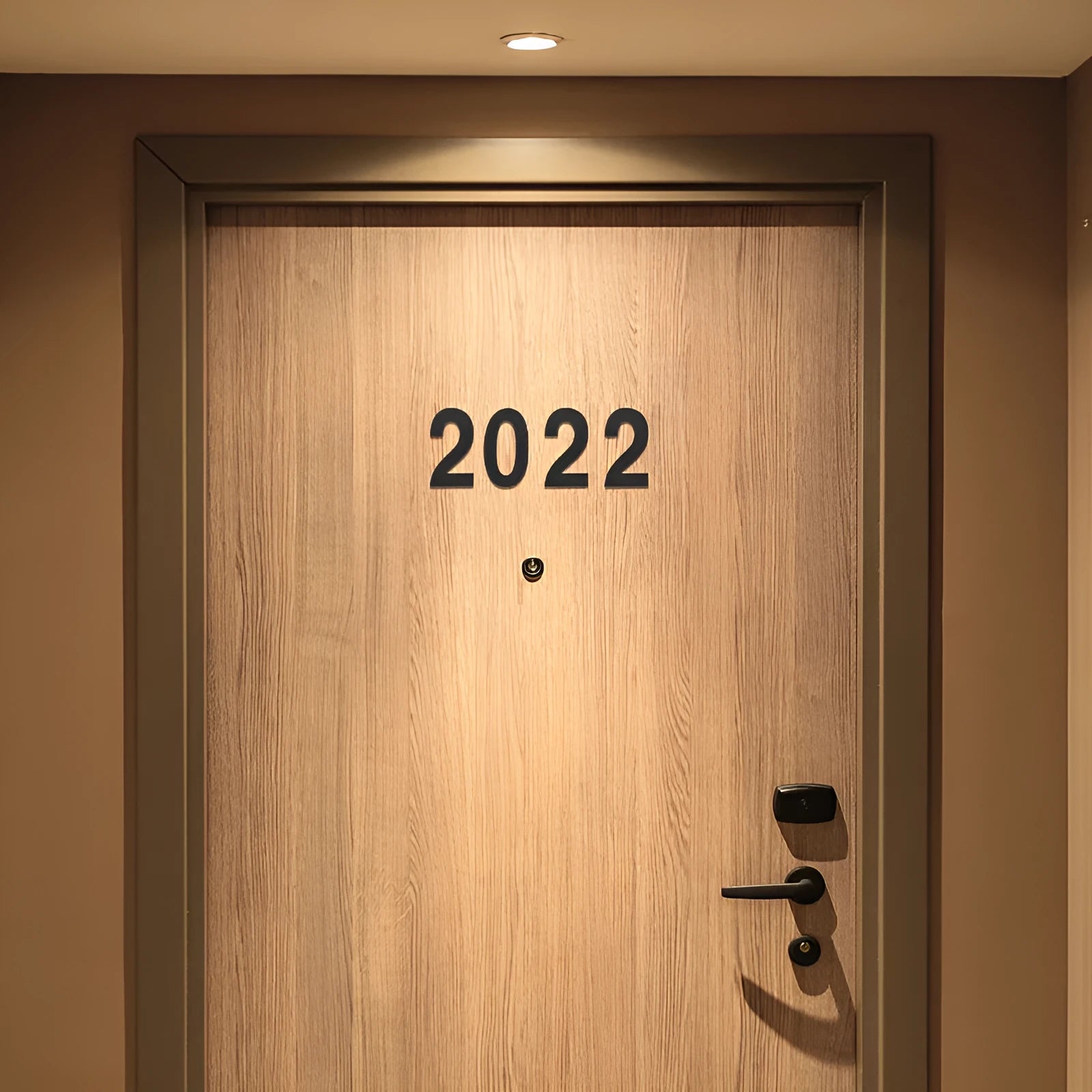 Black stainless steel sticky house number set showing individual letters and digits, 7.5cm in size.