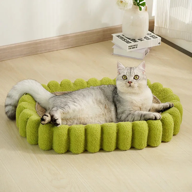 Green oval cat scratch pad and lounger bed made from sisal fabric.