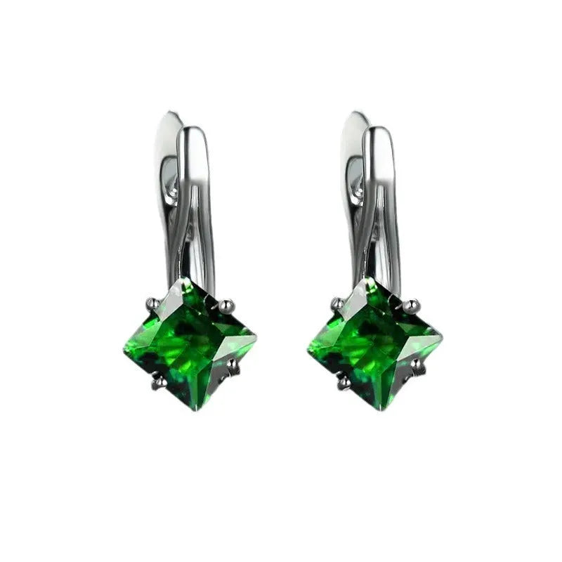 Copper earrings with diamond design and blue zircon inlay for women.