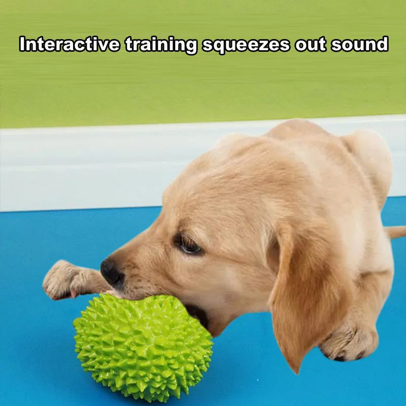 Durian-shaped milk-flavoured dog chew toy in beige with raised bumps for teeth cleaning and a bonus ball