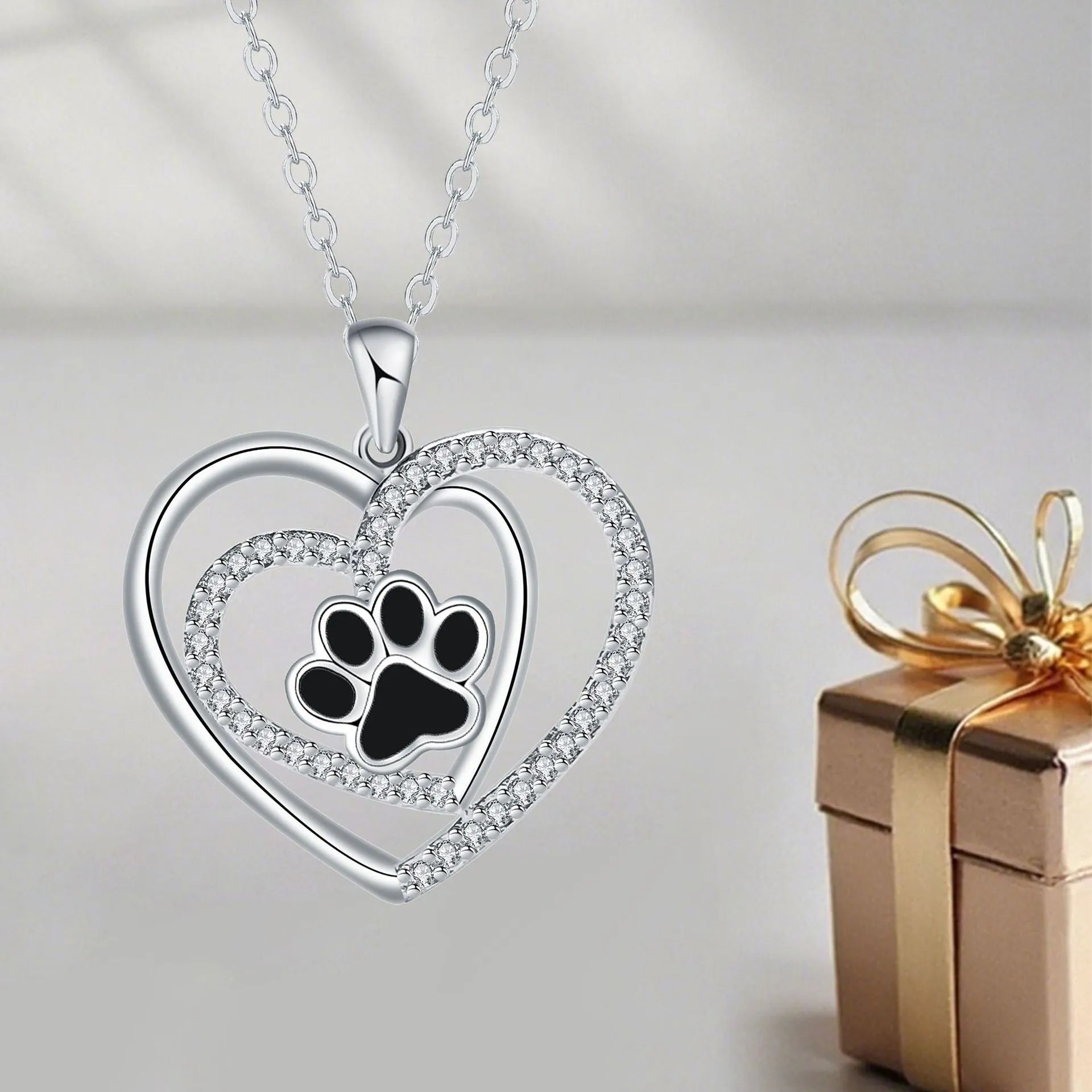 Women's copper dog paw heart pendant necklace on cross chain, electroplated finish.