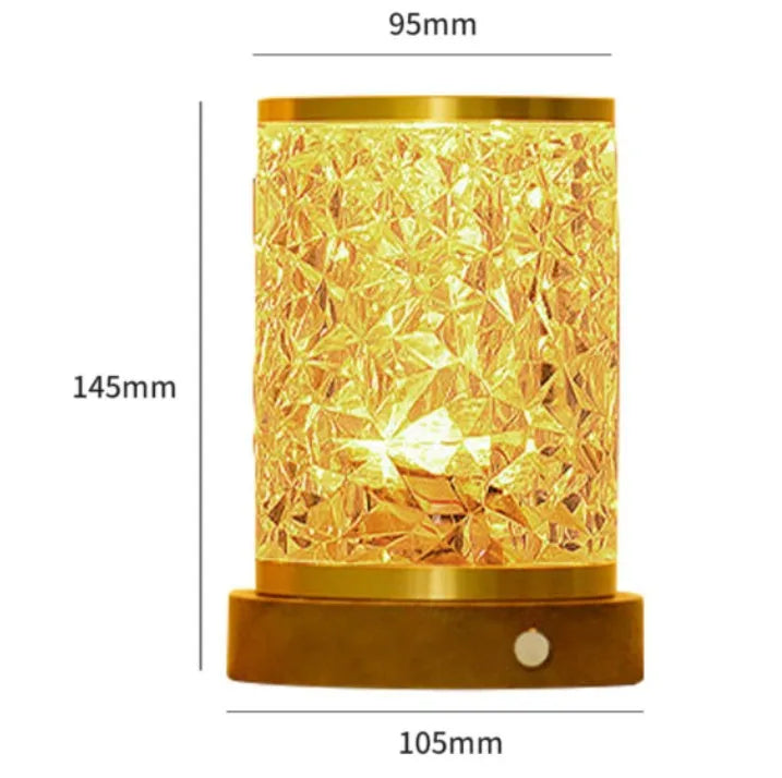 Rotating water ripple effect night light with clear acrylic body on a solid wood base.