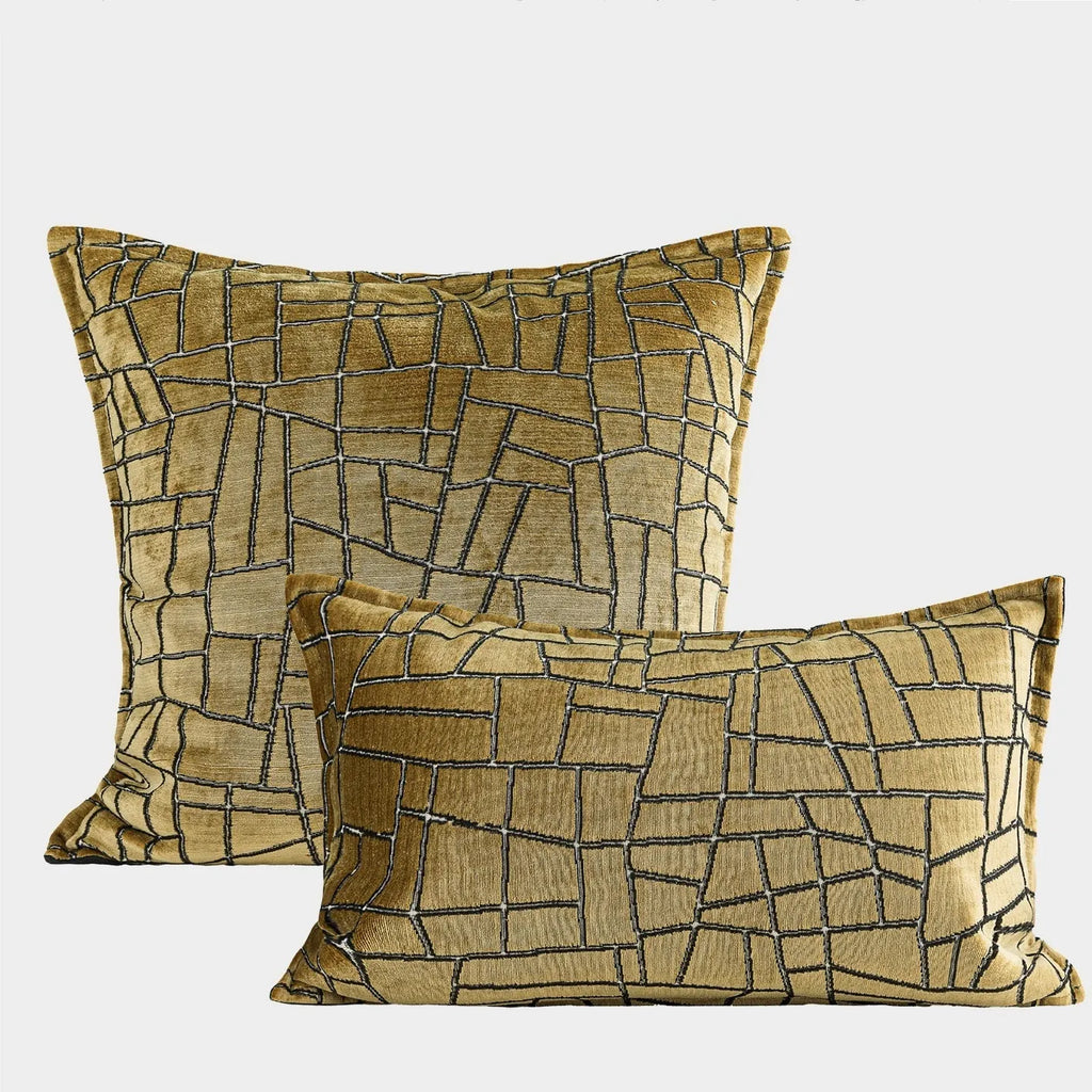 Geometric abstract patterned cushion in local tyrant gold colour, shown in square and lumbar pillow sizes.