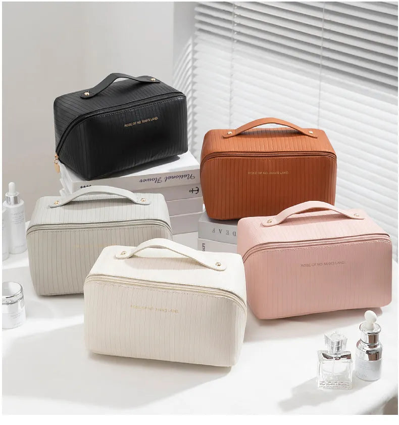 Vertical pattern pillow makeup bag with cubic shape measuring 22.5cm in PU material