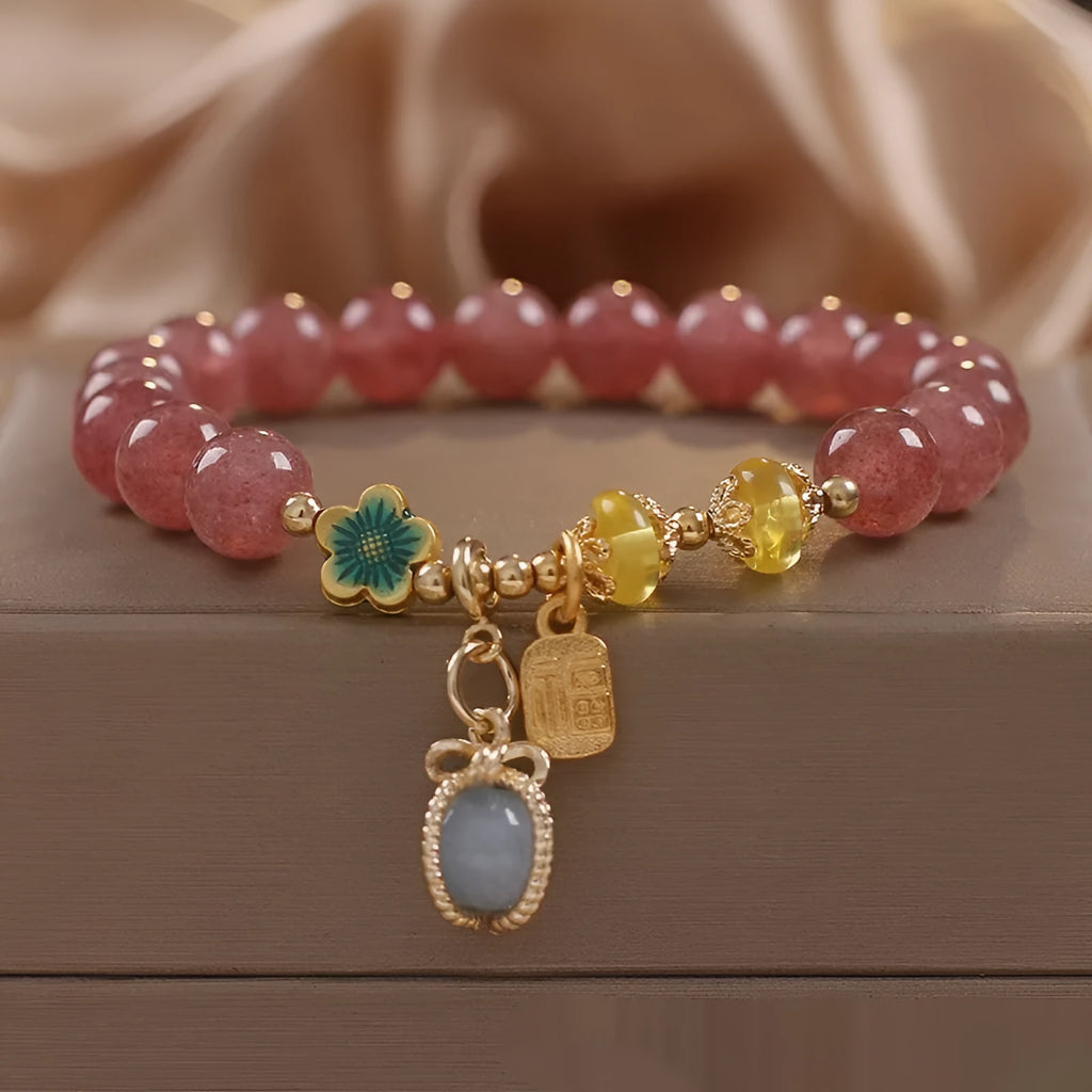 Red strawberry quartz design beaded bracelet for women with alloy metal and rhinestones.