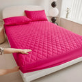 Diamond lattice quilted bamboo fibre waterproof mattress protector set with fitted sheet and pillowcases in grey.