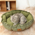 Grey and green reversible donut cat bed shown flat and in raised donut shape