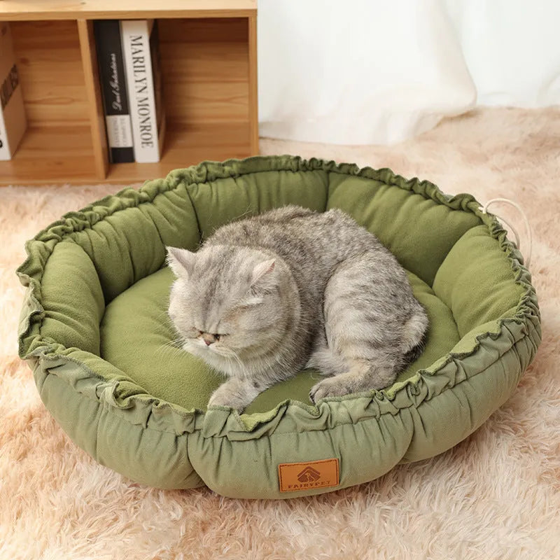 Grey and green reversible donut cat bed shown flat and in raised donut shape