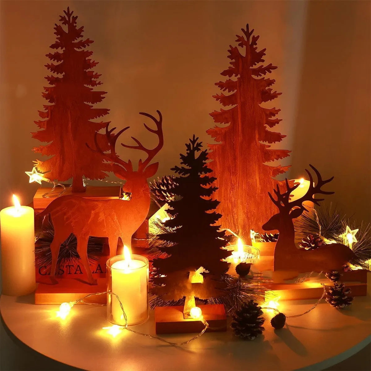 Set of three rustic metal Christmas tree elk ornaments with distressed iron finish.