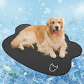 Dog head-shaped Ice Silk pet cooling mat on a hardwood floor, showing non-slip base and light gray colour.