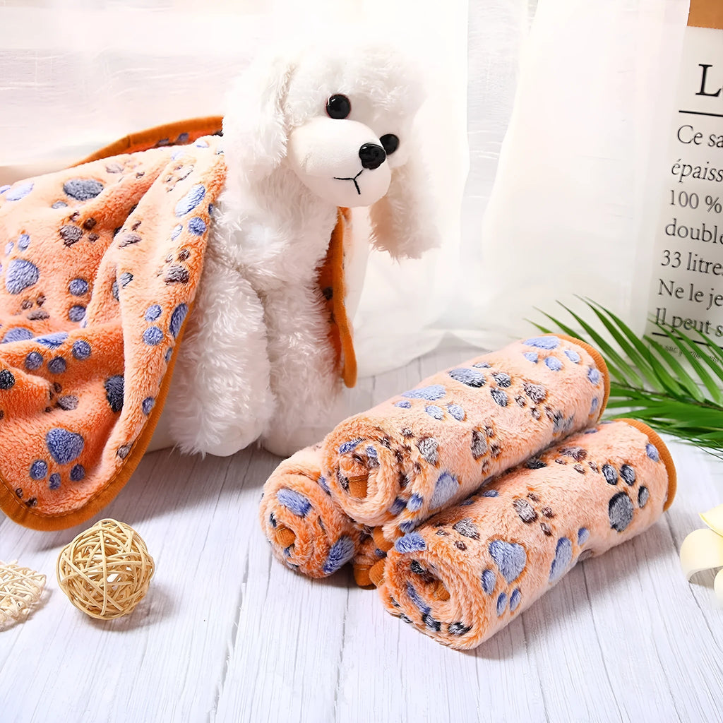 Coral fleece pet blanket with dog paw pattern in various sizes and colours