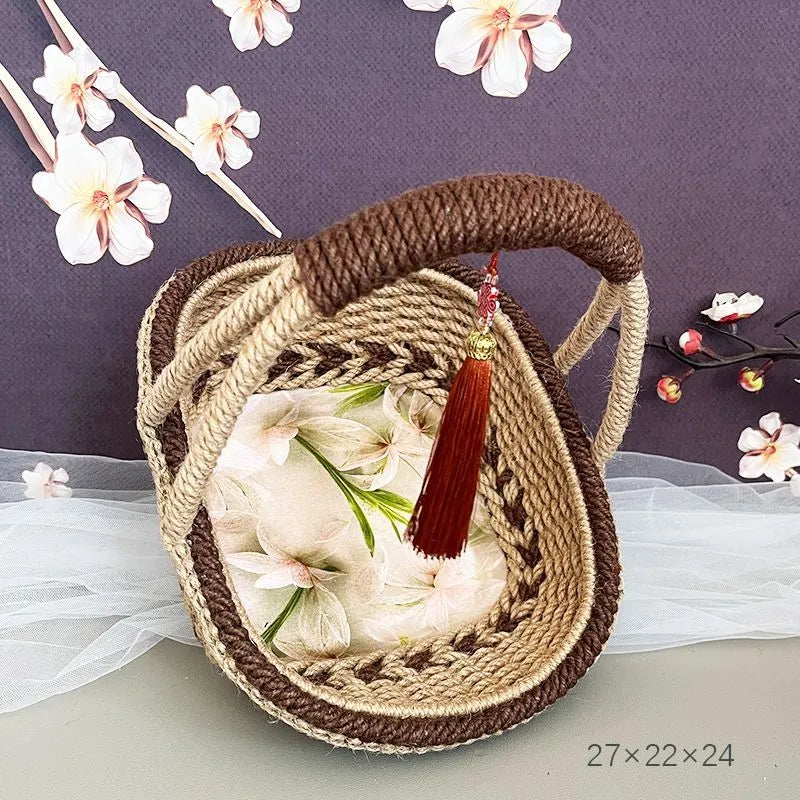 Hand-woven rustic straw storage basket in coffee brown colour.