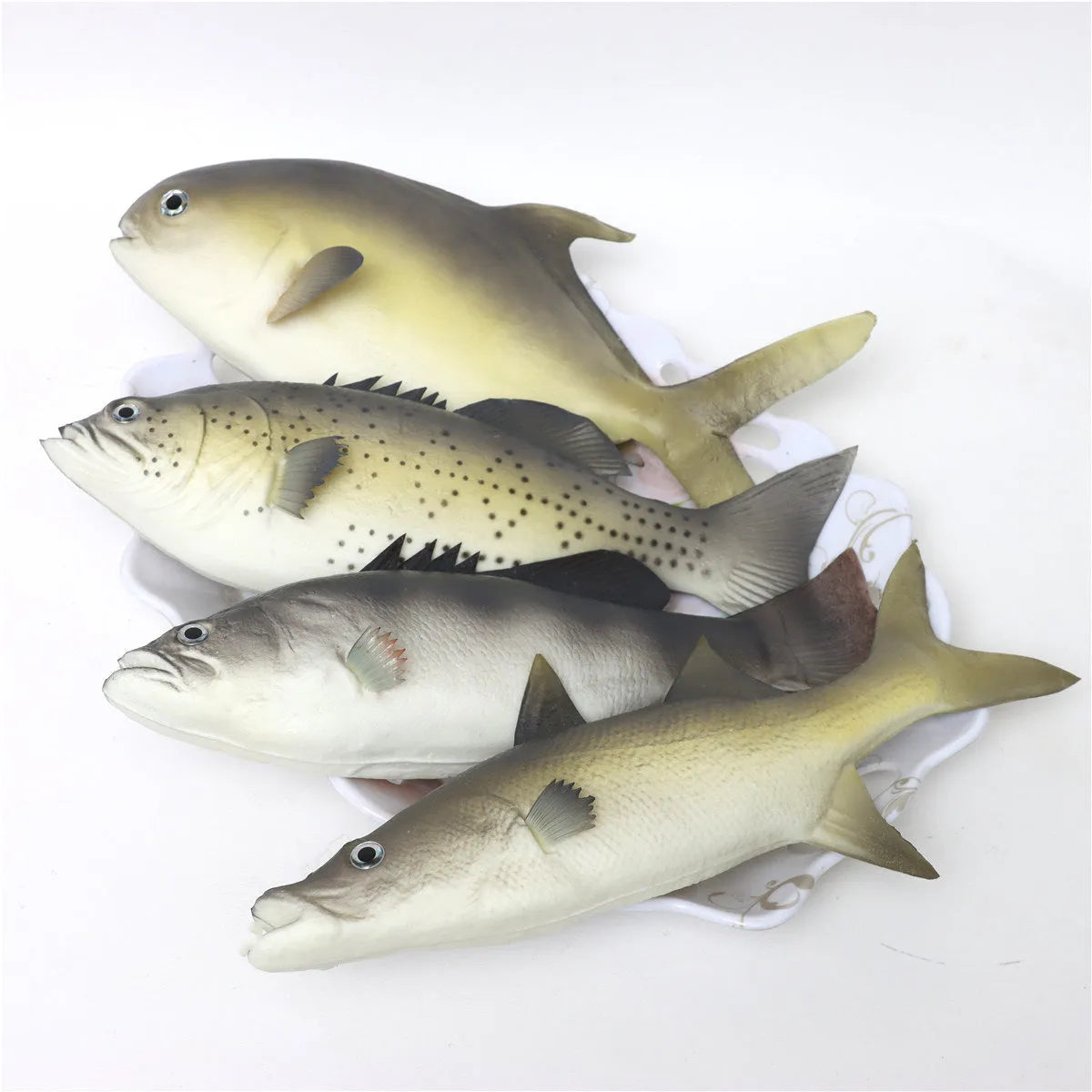 Three PU simulated tuna fish ornaments including yellow-fin tuna and small tuna varieties