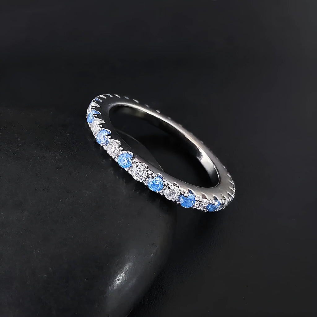 Zircon inlaid copper ring with geometric design in green colour, size shown as size 7.