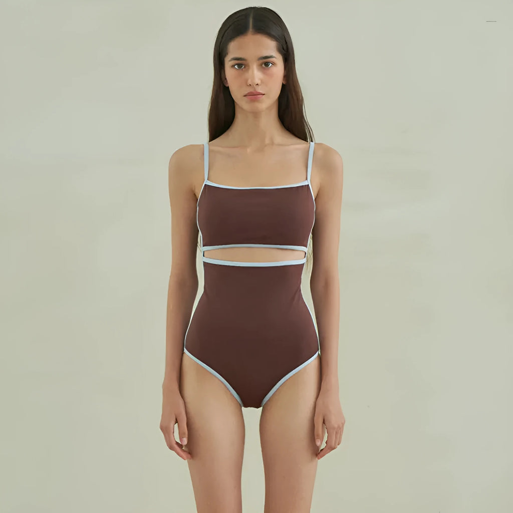 Brown women's triangle one-piece swimsuit with a pattern, shown on a hanger