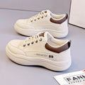 Women's white Korean-style leather pumps with cross strap design and round toe