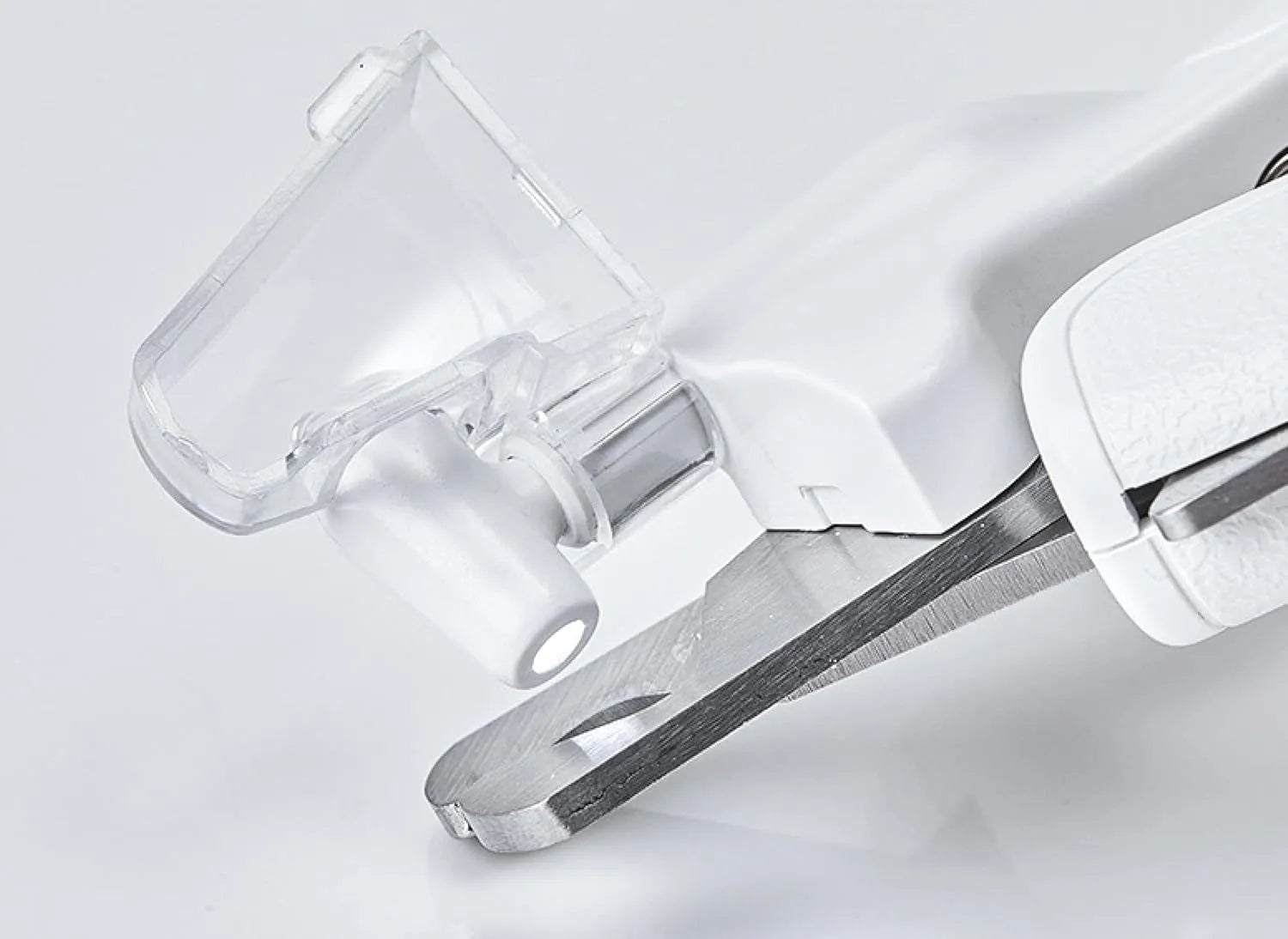 White pet nail clippers with LED light, transparent anti-splash guard open, and separate nail file.