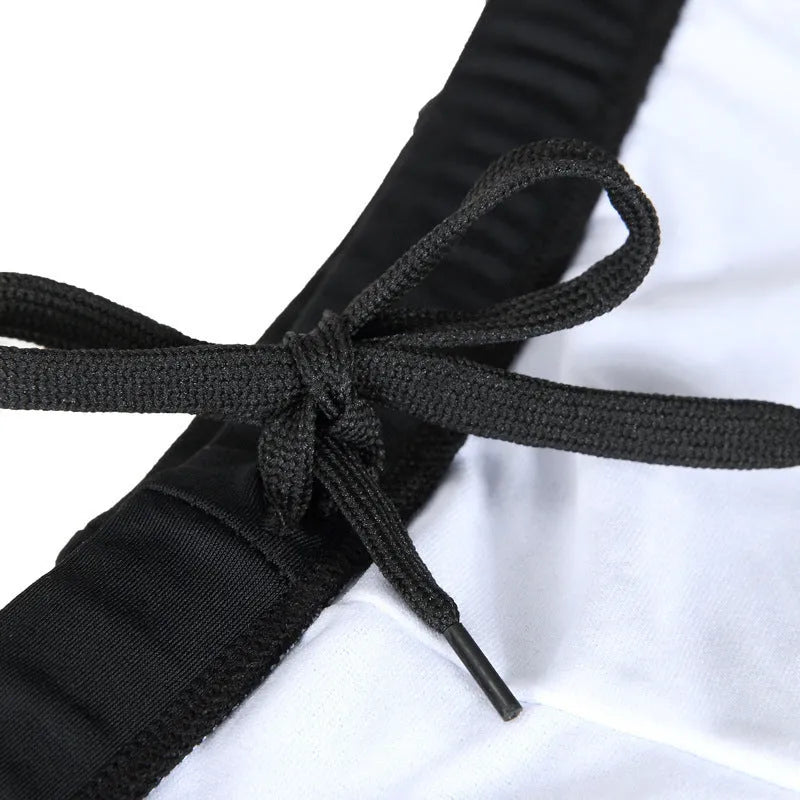 Men's plus size black swimming trunks with blue flame pattern, boxer style.