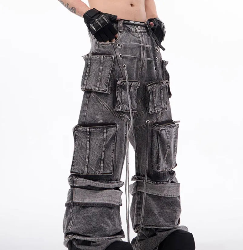 Grey distressed cotton denim mop pants with rope stitching, shown in a relaxed fit.