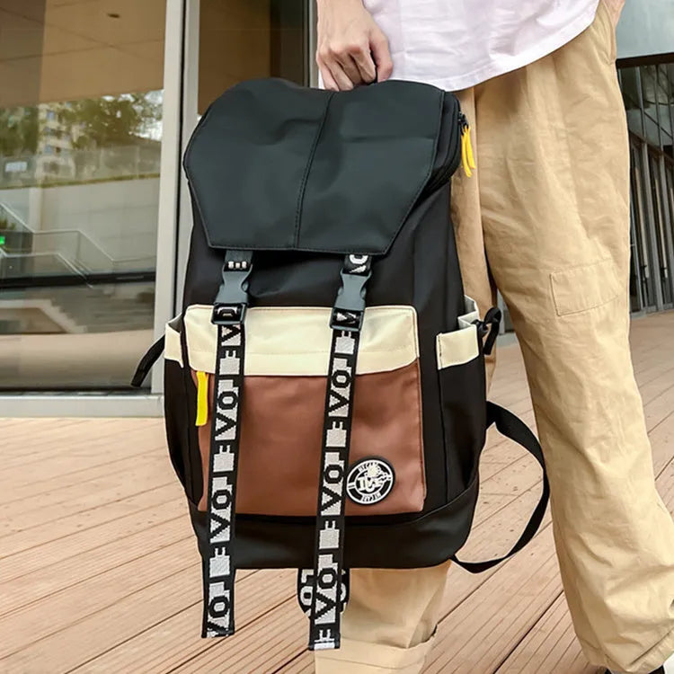 Oxford cloth backpack in black, green, or red with shoulder straps and 32cm by 46cm dimensions