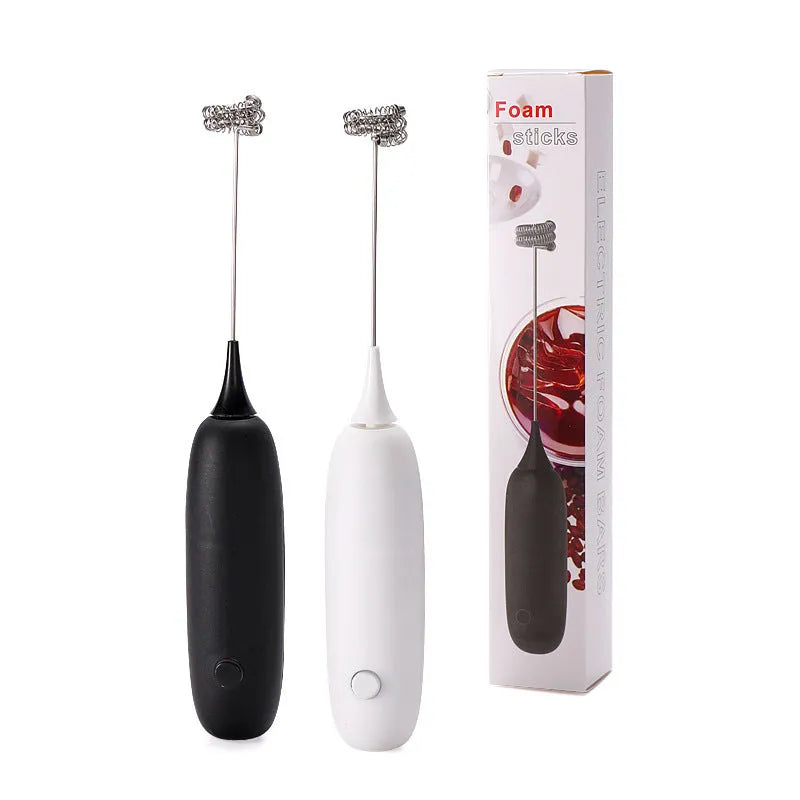 Black and white hand-held electric milk frother blender for coffee preparation