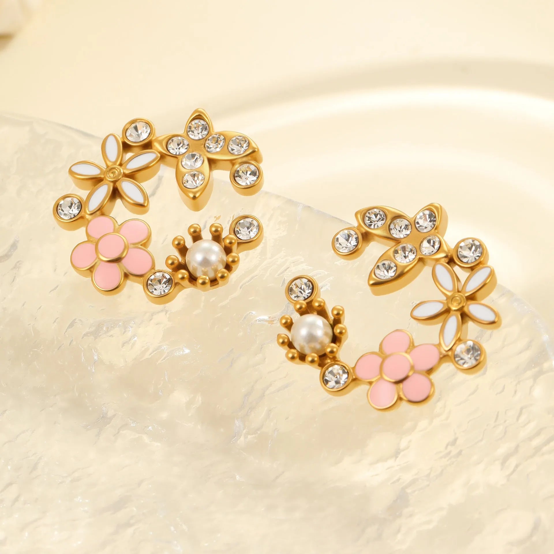 Flower petal stud earrings in 18K stainless steel with electroplated finish