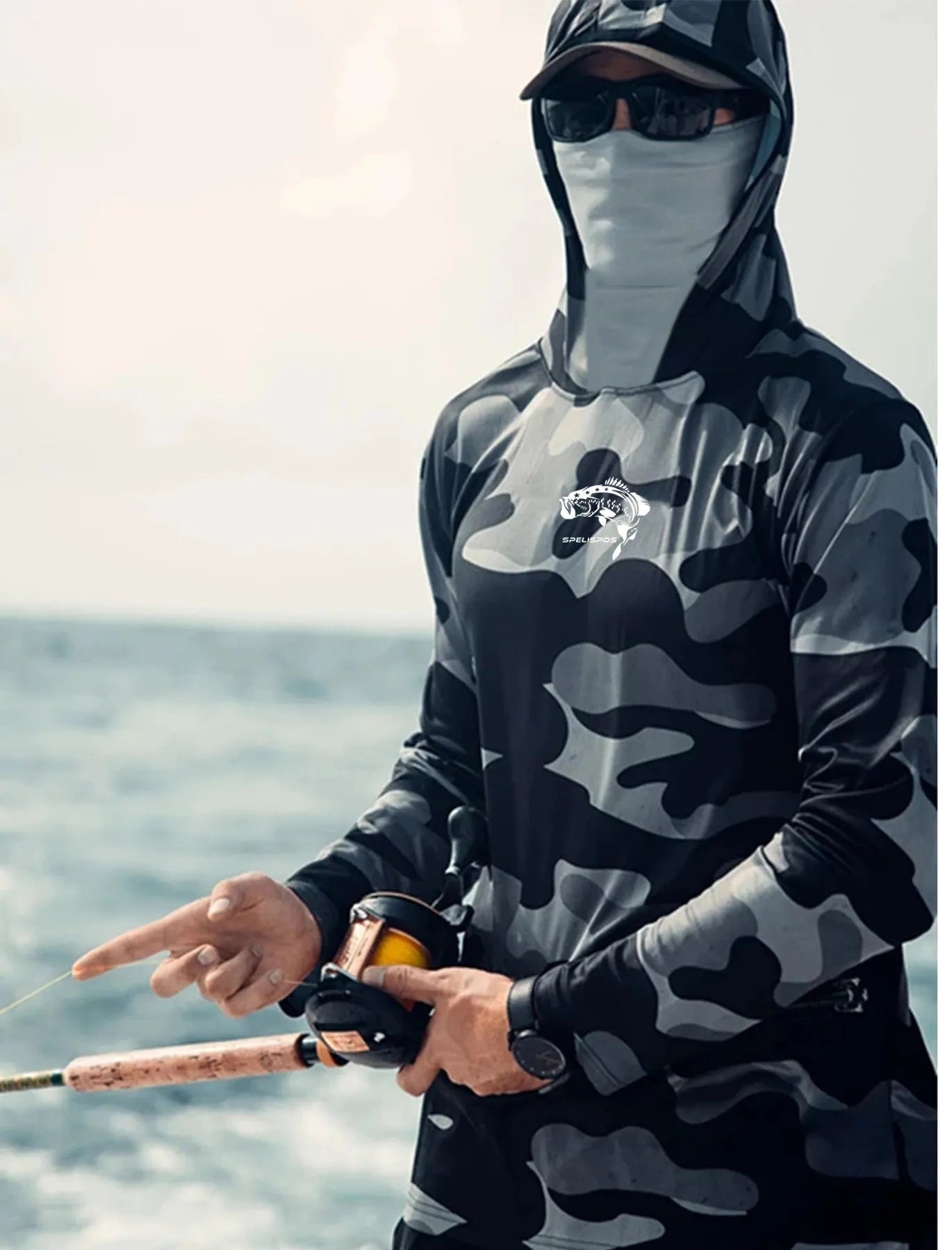 Huk long sleeve performance fishing shirt with crew neck and mesh side panels.