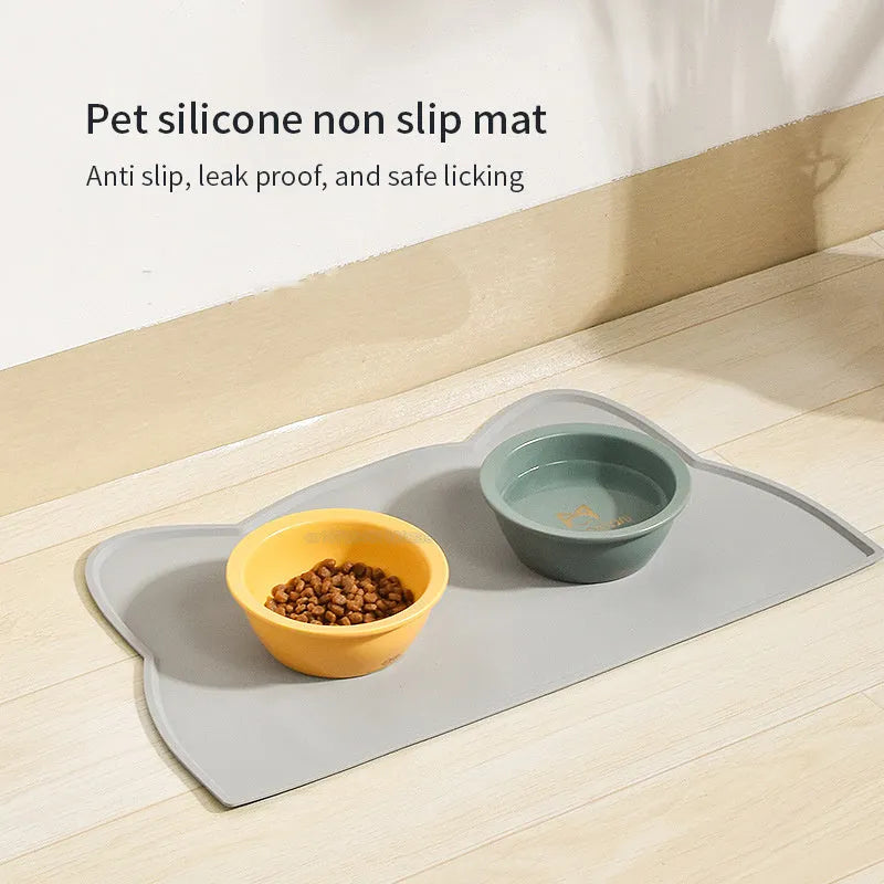 Cat head shaped silicone pet feeding mat in solid colour measuring 44 by 24 centimetres