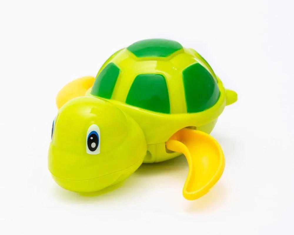 Yellow wind-up plastic turtle water toy on blue surface, 12cm clockwork mechanism