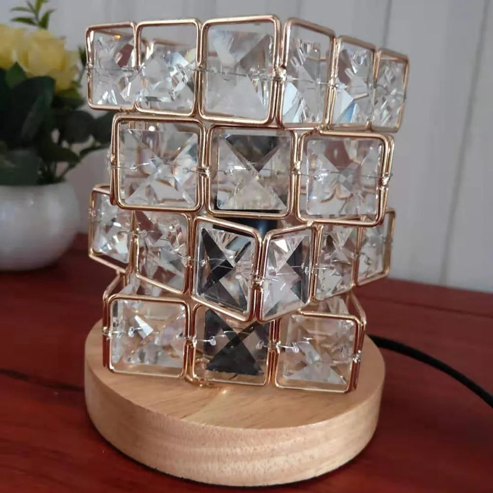 Himalayan crystal salt lamp with dimmer switch on wooden base emitting warm amber glow