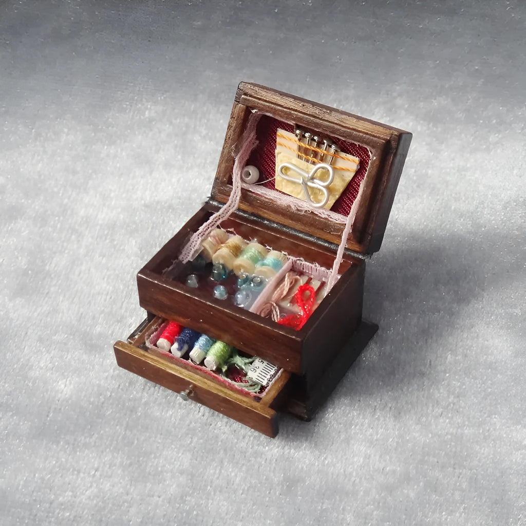Miniature wooden sewing machine ornament with European-style design on display