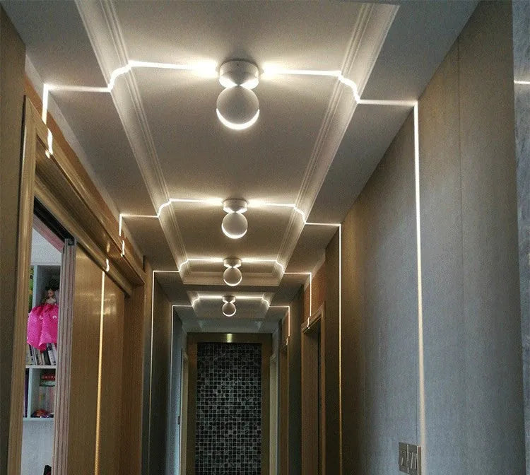 Modern aluminium corridor wall spotlight bar lamp with coloured LED options on a wall.