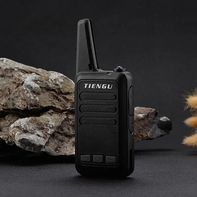 TIENGU black wireless handheld radio with LED flashlight, USB port, and back clip on a white background