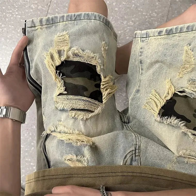 Men's camouflage pattern denim shorts with distressed rip detailing in yellow mud colour