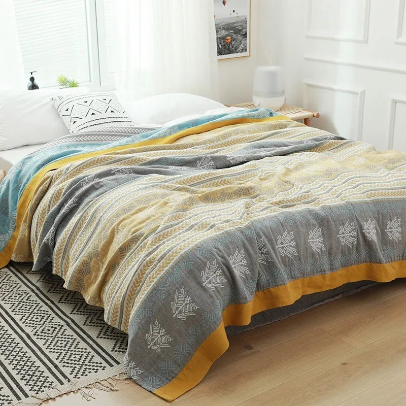 Five-layer cotton gauze bed sheet blanket in Roulette Wheel Blue pattern showing reactive dye printing detail