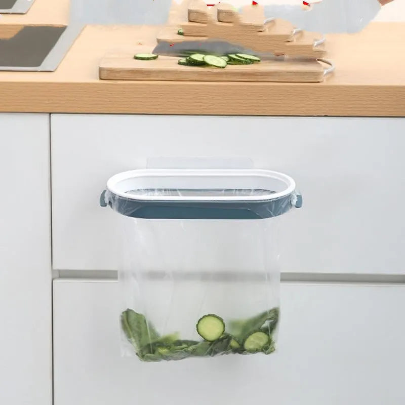 Blue plastic kitchen garbage bag storage rack mounted under cabinet holding roll of bin liners