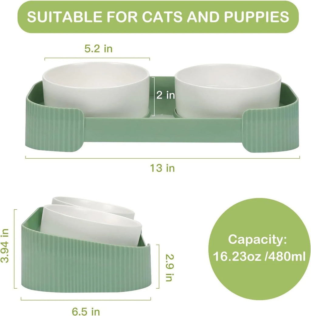 Green ceramic elevated cat bowls with tilted design on non-slip base for food and water