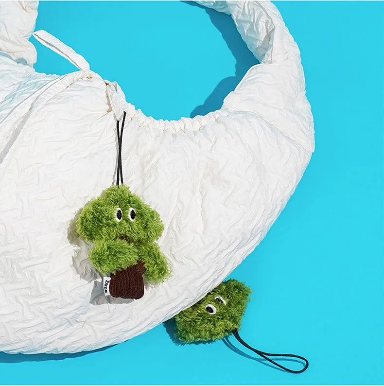 Green pine tree shaped cat toy pendant with a hanging loop, shown next to a tape measure indicating 12cm length.