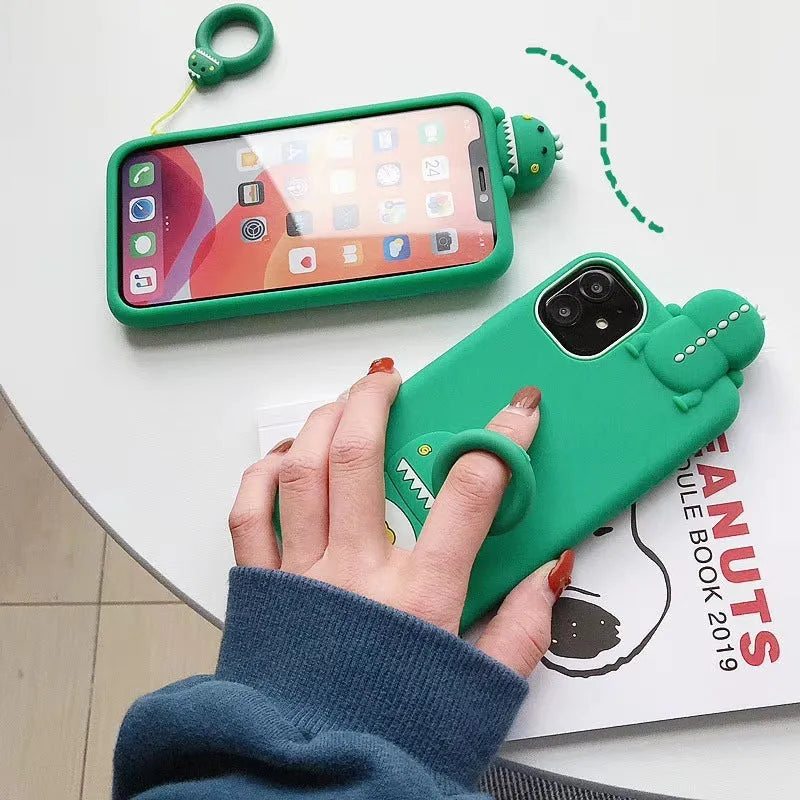 Green silicone iPhone case with a cartoon animal design on the back.