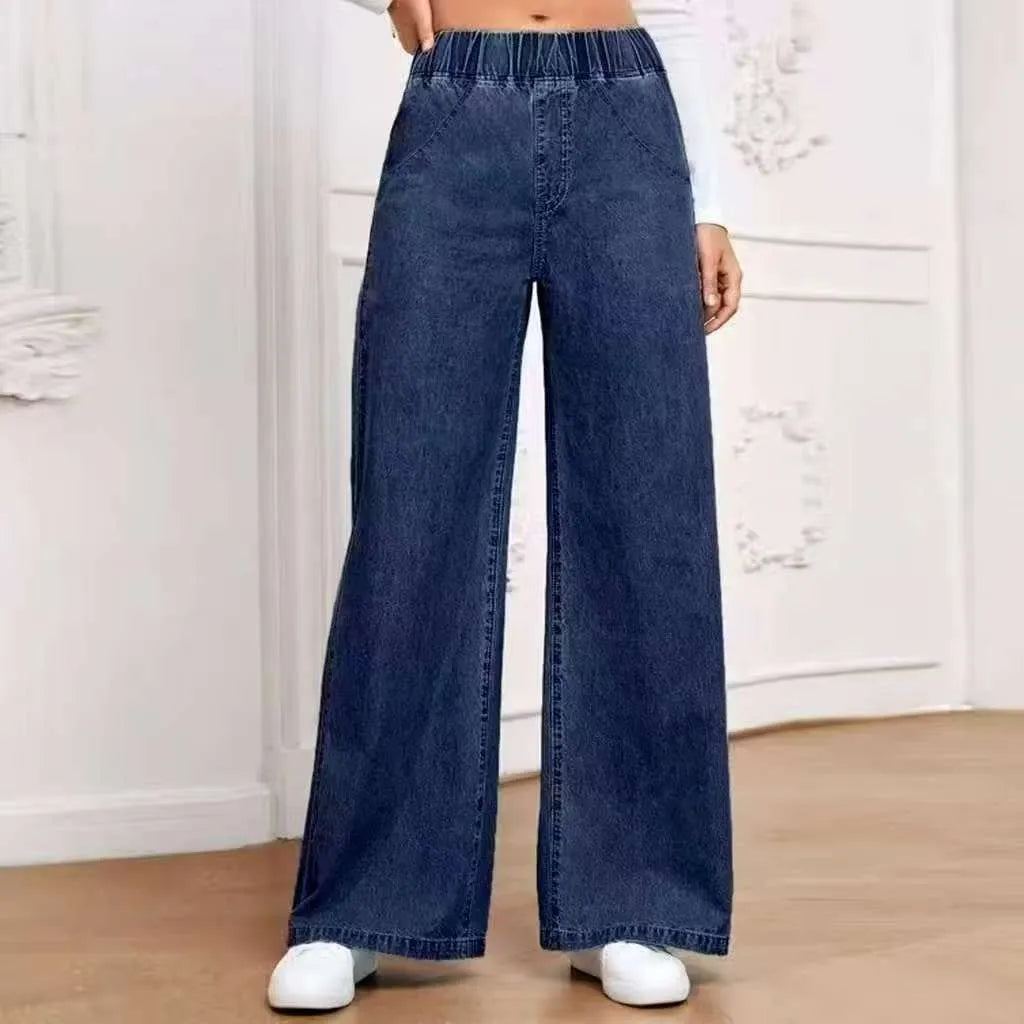 Light blue washed wide-leg plus size jeans with straight-leg design and zip fly