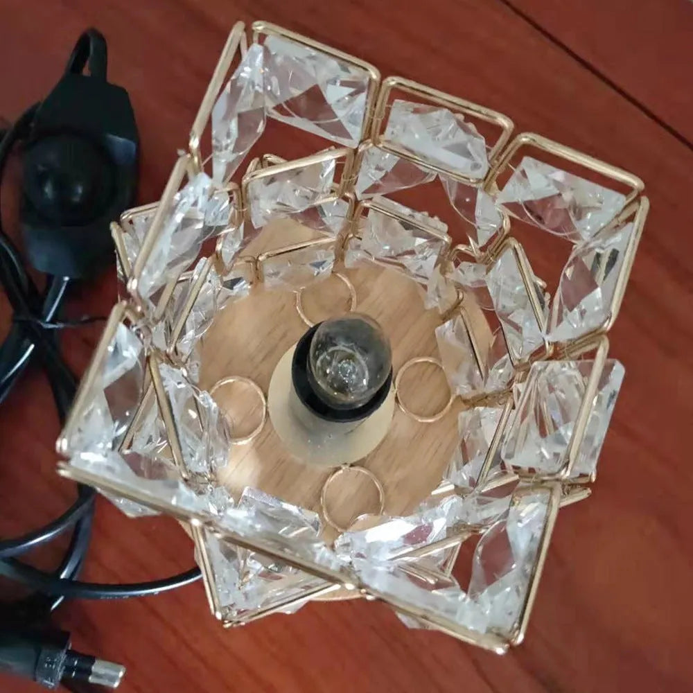 Himalayan crystal salt lamp with dimmer switch on wooden base emitting warm amber glow