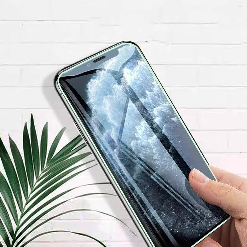 Luminous tempered glass screen protector for iPhone showing glow feature in dark setting