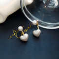 Korean style heart-shaped women's stud earrings with artificial pearl inlay on alloy posts