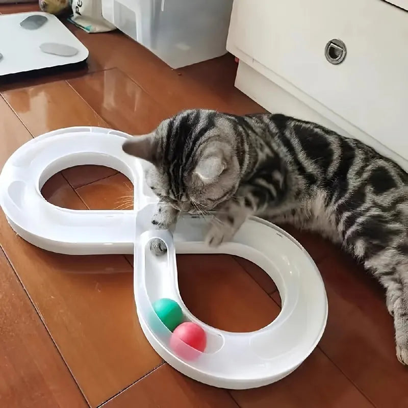 Blue and white interactive cat toy set with turntable track, ball, and teasing stick on floor