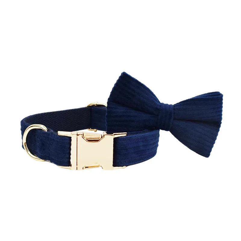 Navy blue corduroy dog collar leash set with bow, vest, and poop bag on white background