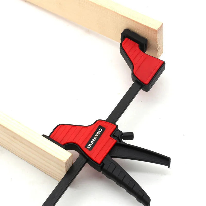 Black plastic quick-adjust woodworking clamp with rubber grips, shown in various sizes.